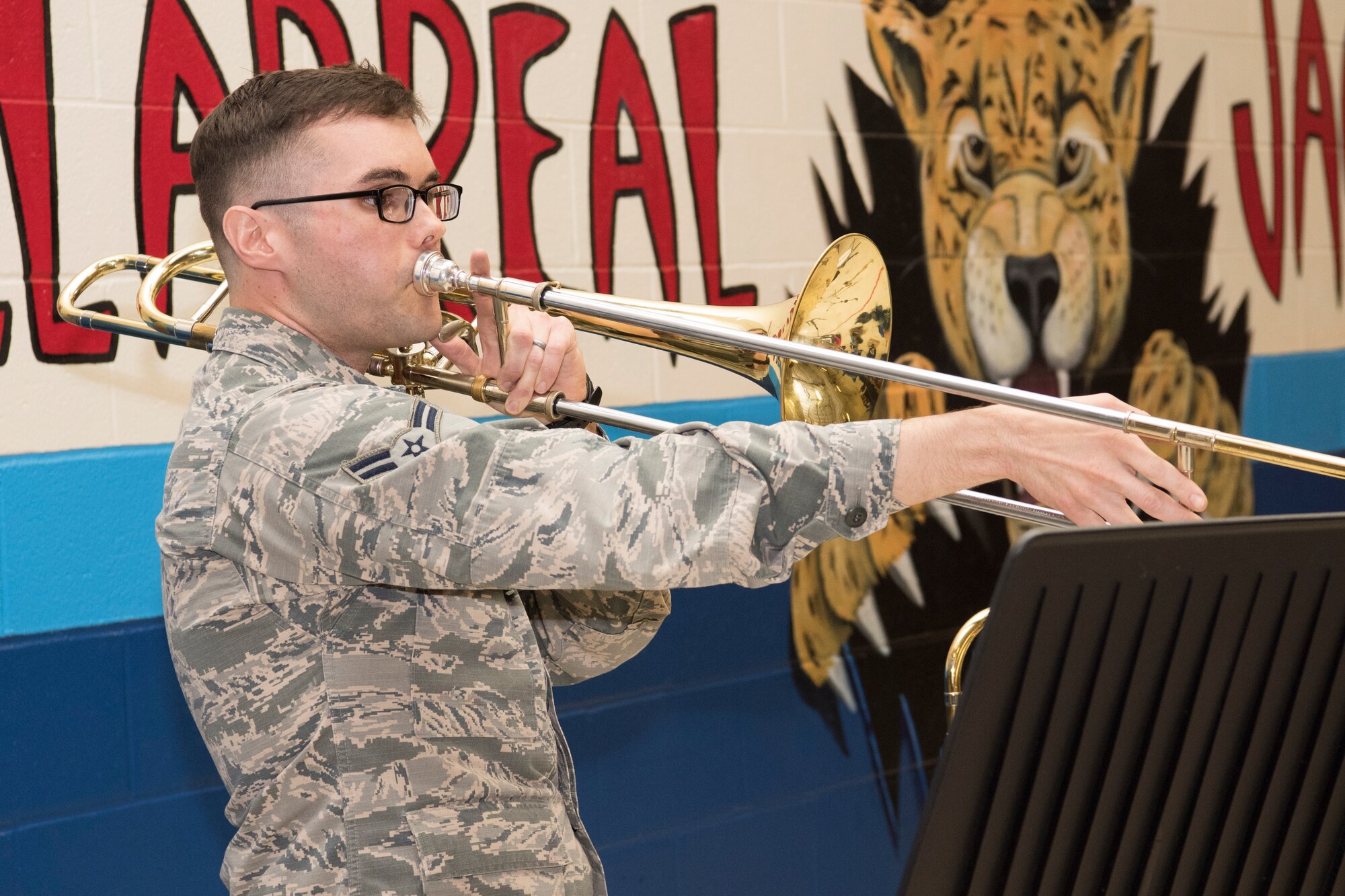 Airmen 1st Class Michael Steiger, U.S. Air Force Band of the West trombonist, performs for Villarreal Elementary students Oct. 17, 2018, at San Antonio, Texas.