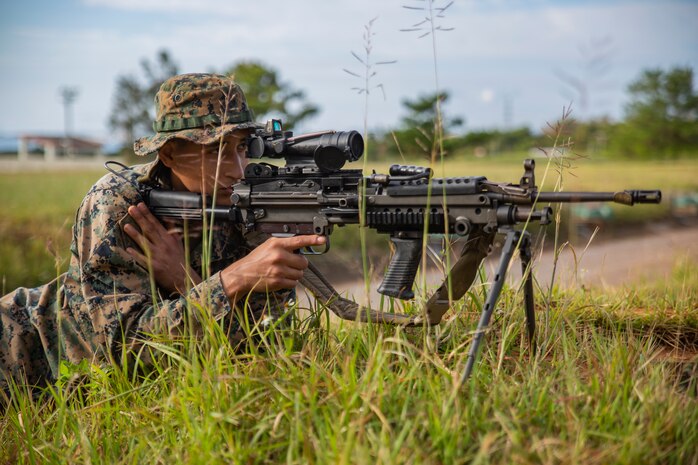 Cpl. Levi Galindo sights in on a target with a M249 Light Machine Gun during a fire and movement range Oct. 24, 2018, at Camp Hansen, Okinawa, Japan. During the range, Marines with 3rd Marine Logistics Group practiced their marksmanship skills, improved their communication and worked on their weapons handling while engaging targets. Galindo is a native of Las Vegas, Nevada, and is a machine gunner with the Tactical Readiness and Training, G-3, 3rd Marine Logistics Group Headquarters. (U.S. Marine Corps photo by Lance Cpl. Terry Wong)