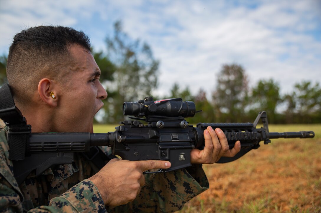 Cpl. Alberto Castillolopez screams out instructions to his fireteam during a fire and movement range Oct. 24, 2018, at Camp Hansen, Okinawa, Japan. During the range, Marines with 3rd Marine Logistics Group practiced their marksmanship skills, improved their communication and worked on their weapons handling while engaging targets. Castillolopez is a native of Riverside, California, is a machine gunner with the Tactical Readiness and Training, G-3, 3rd MLG Headquarters. (U.S. Marine Corps photo by Lance Cpl. Terry Wong)