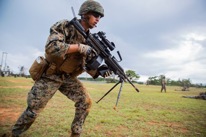 Cpl. Levi Galindo sprints towards his next position during a fire and movement range Oct. 24, 2018, at Camp Hansen, Okinawa, Japan. During the range, Marines with 3rd Marine Logistics Group practiced their marksmanship skills, improved their communication and worked on their weapons handling while engaging targets. Galindo is a native of Las Vegas, Nevada, and is a machine gunner with the Tactical Readiness and Training, G-3, 3rd Marine Logistics Group Headquarters. (U.S. Marine Corps photo by Lance Cpl. Terry Wong)