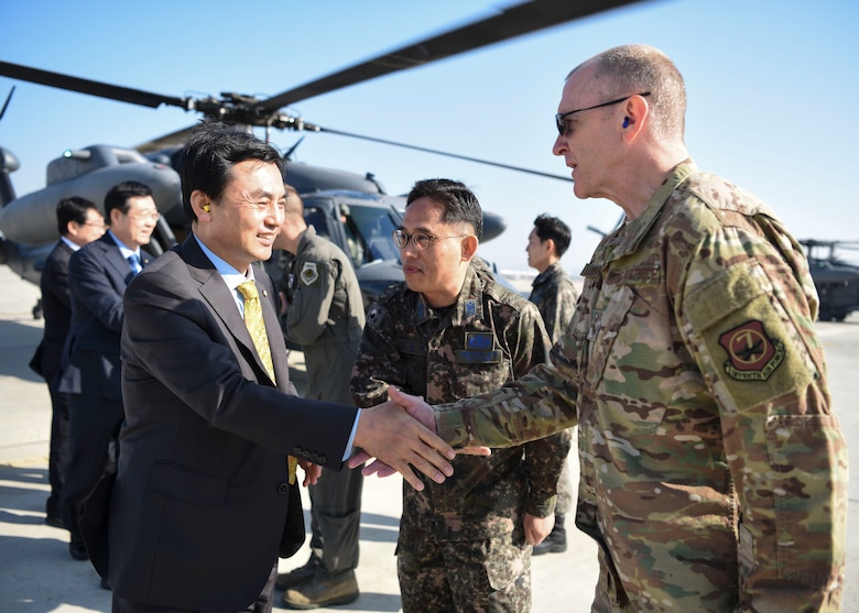 U.S. Air Force Chief Master Sgt. Scott Lumpkin, Seventh Air Force command chief, greets members of the National Defense Committee at Osan Air Base, Republic of Korea, Oct. 25, 2018. The NDC conducted an Air Force Operations Command site inspection and observed flight line operations. (U.S. Air Force photo by Airman 1st Class Ilyana A. Escalona)