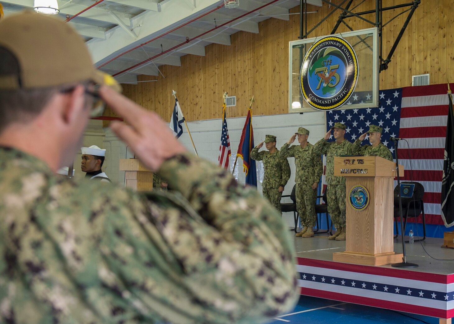 SANTA RITA, Guam, (Oct. 26, 2018) Captain Robert Baughman, gives his final remarks as Commander, Task Force (CTF) 75 as he relinquishes command to Capt. Eric C. Correll during a change of command ceremony held at Naval Base Guam. CTF 75, the primary expeditionary task force responsible for the planning and execution of coastal riverine operations, explosive ordnance disposal, diving engineering and construction, and underwater construction in the U.S. 7th Fleet area of operations.