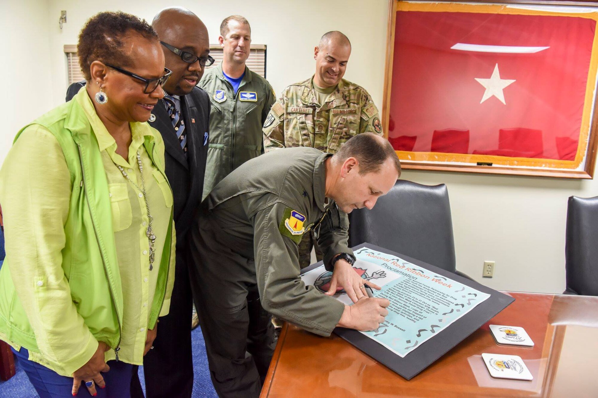 U.S. Air Force Brig. Gen. Gentry Boswell, 36 Wing Commander, signs a proclamation kicking off Red Ribbon week at Andersen Air Force Base, Guam, Oct. 26, 2018. (U.S. Air Force photo by Senior Airman Christopher Quail)