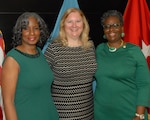 Defense Logistics Agency Troop Support employees Debra Tillman, Mary Newell and Bernice Eaddy-Brown (left to right) pose after an Oct. 25 retirement ceremony in Philadelphia honoring their 110 years of cumulative service to the agency.