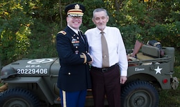 MULDRAUGH, Ky. - Col. Sidney Melton, chief of staff for 1st Theater Sustainment Command, and Mayor Joseph E. Noon, Sr. shake hands before the Muldraugh "Down Home Days" parade, Oct. 6. Melton served as one of the grand marshals for the parade. The 1st TSC team also provided the color guard and HMMV for the event. 1st TSC is honored to be partnered with the community of Muldraugh. (U.S. Army photos by Mr. Brent Thacker)