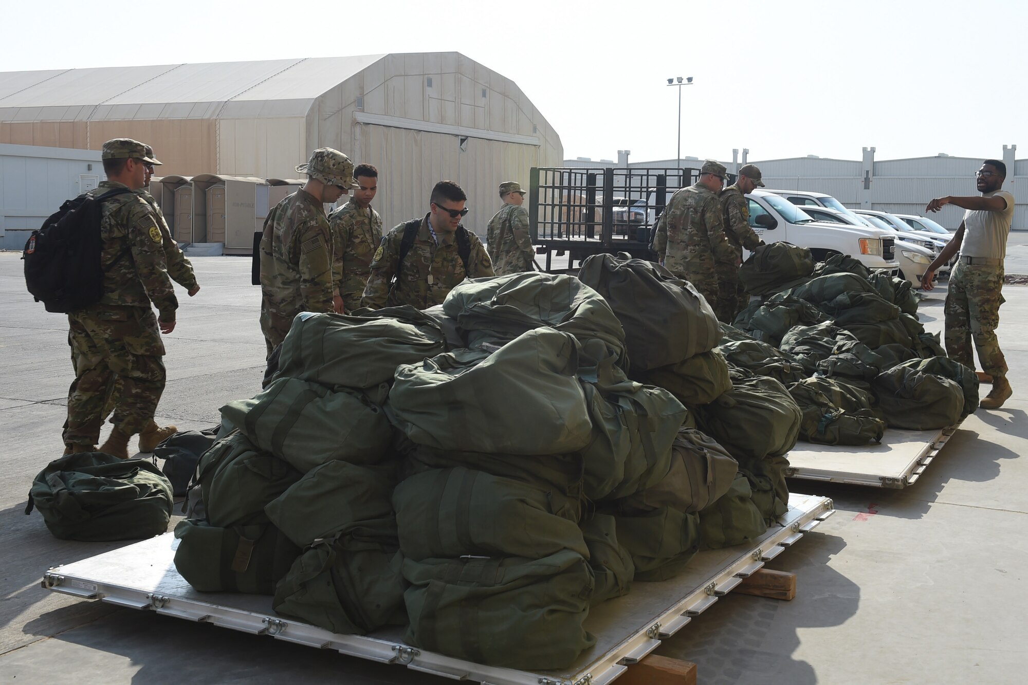 Airmen unload cargo from a C-17