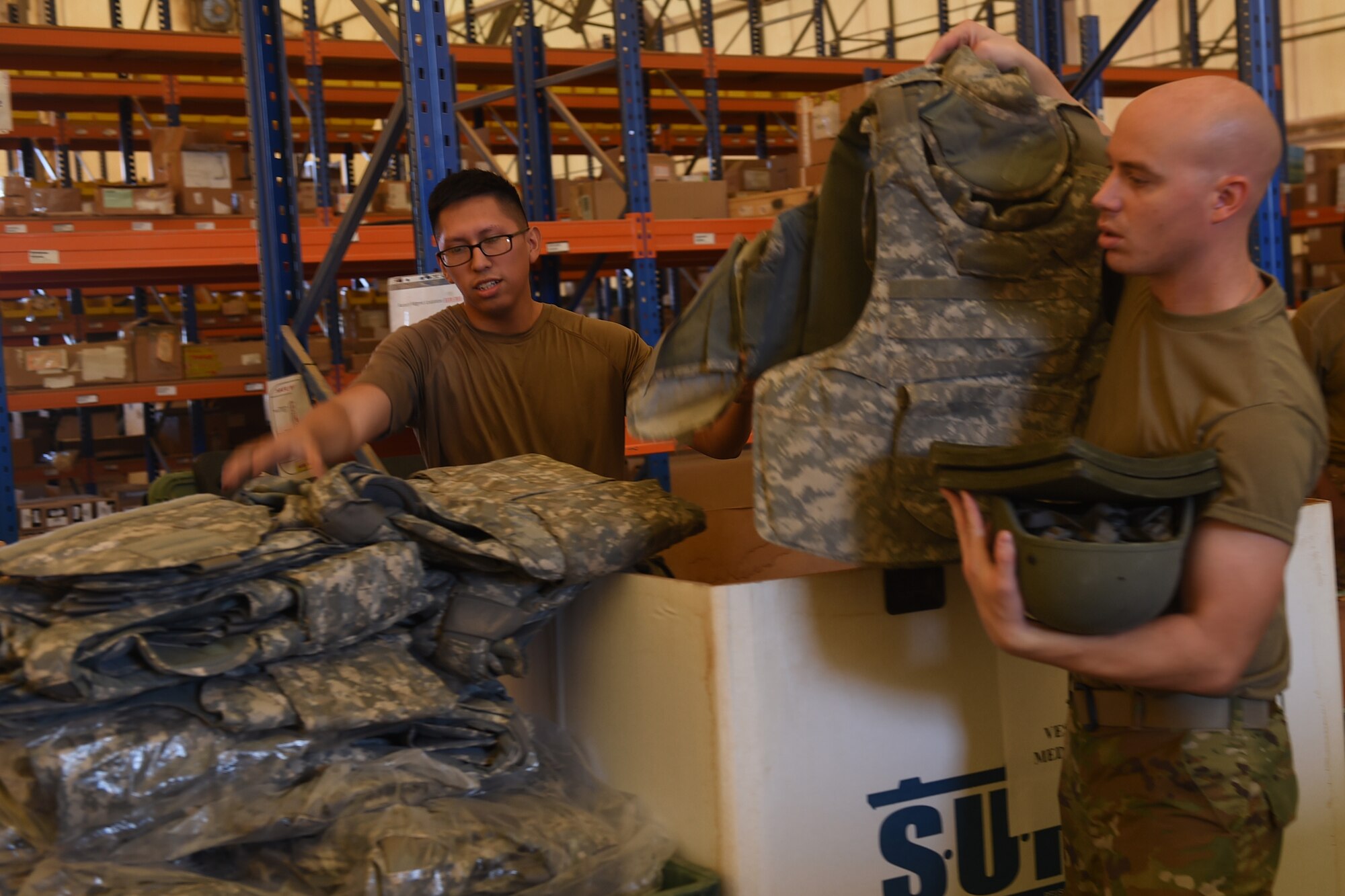 Airmen issue mobility bags to new arrivals