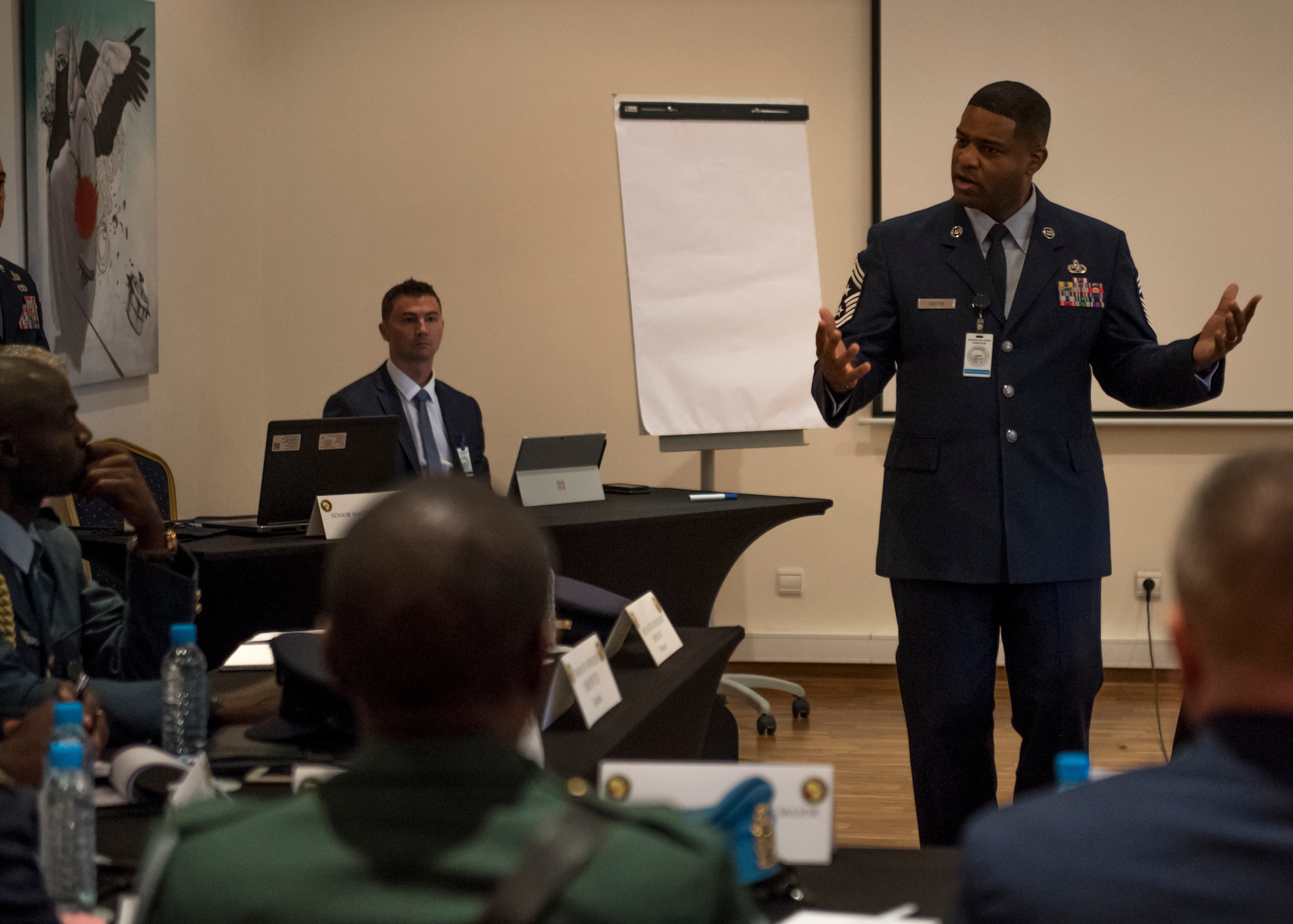 Chief Master Sergeant Phillip L. Easton, USAFE-AFAFRICA Command Chief, addresses a room of senior enlisted African military officials during the 8th annual African Air Chiefs Symposium (AACS). This year marks the first time in the history of AACS that African enlisted leaders participated  with the air chiefs to discuss African air defense issues and ways to increase military cooperation. (DoD photo by Mass Communication Specialist 2nd Class Cody Hendrix/Released)