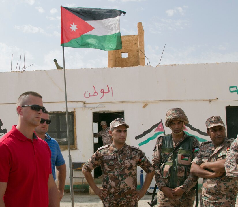 U.S. Army Capt. Jeffrey Koehler, operations officer with the 157th Military Engagement Team, Wisconsin National Guard, and Jordanian Armed Forces soldiers discuss border guard securities operations, Oct. 8, 18, near Amman, Jordan. Security is a very important factor in maintaining force readiness.