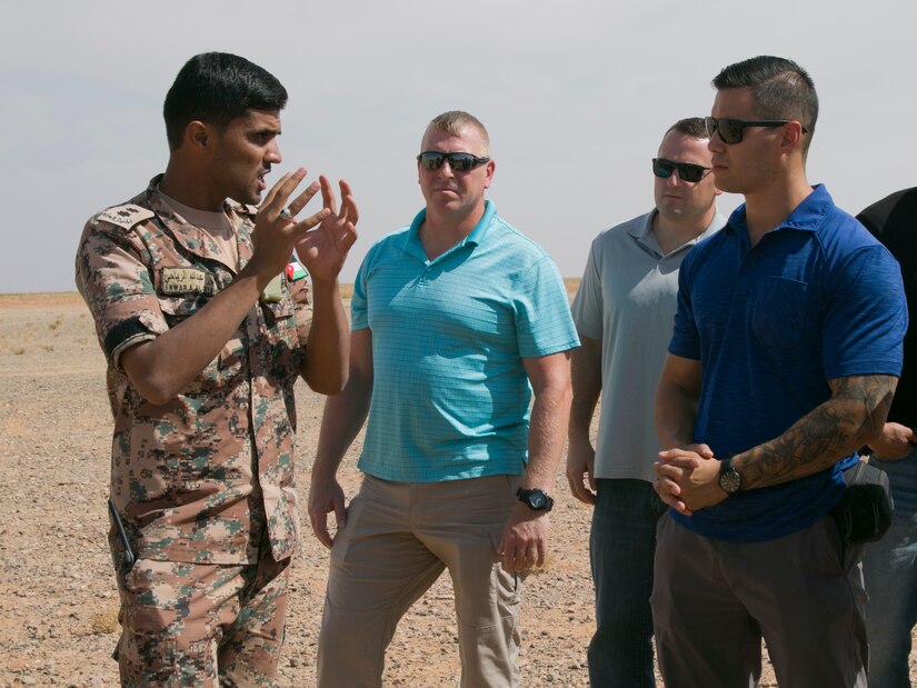 Jordan Armed Forces 1st Lt. Anwar A. Al Ryahi, a platoon leader with the 4th Battalion Border Guard Force, explains the importance of the Javelin missile to U.S. Army Staff Sgt. Joseph Wong, assistant operations NCO with the 157th Military Engagement Team, Wisconsin Army National Guard, during a simulated quick-reaction force battle drill, Oct., 18, near Amman, Jordan. The Javelin is an anti-tank missile capable of defeating modern tanks by attacking them from above.