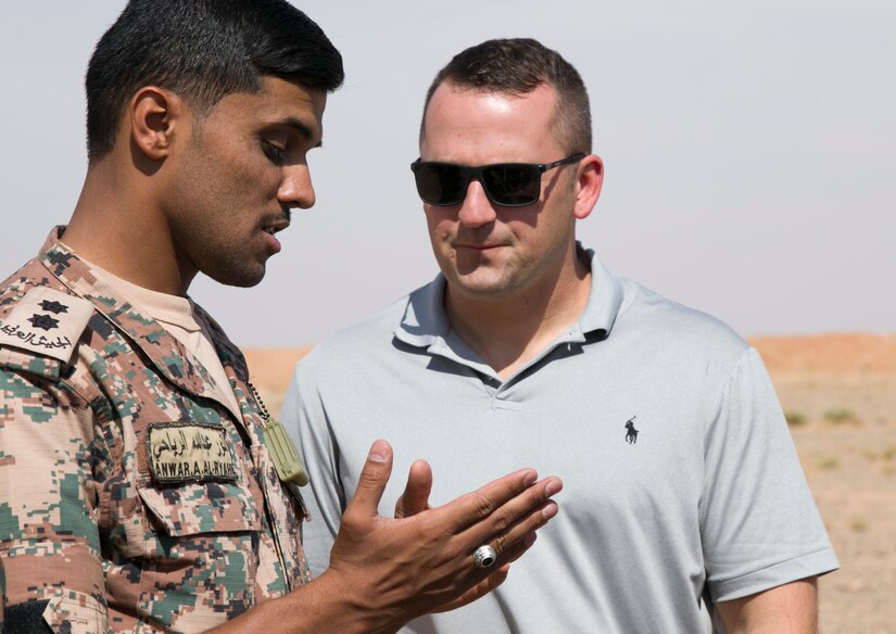 Jordan Armed Forces 1st Lt. Anwar A. Al Ryahi, 4th Battalion Border Guard Force Platoon Leader, explains quick-reaction force tactics to U.S. Army Master Sgt. Michael Pembroke, future operations NCO with the 157th Military Engagement Team-Kuwait, Wisconsin National Guard, how the JAF prepare for react-to-contact training missions, Oct. 7, 18, near Amman, Jordan. Joint military engagements promote continuity among allied nations and allow a better understanding of each nations capabilities.