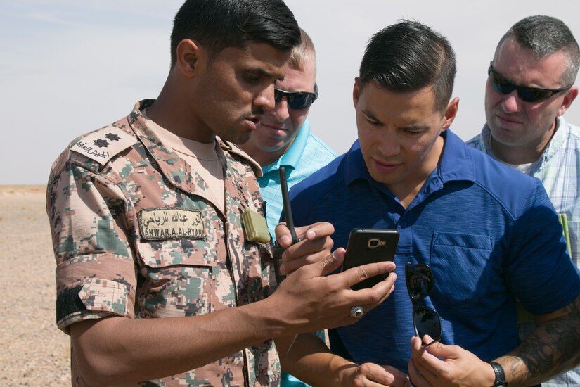 Jordan Armed Forces 1st Lt. Anwar A. Al Ryahi, 4th Battalion Border Guard Force Platoon Leader, shows videos of the Jordanian Armed Forces mobile training team to the 157th Military Engagement Team, Wisconsin Army National Guard, during a training assessment, Oct. 7, 18, near Amman, Jordan. Engagements such as these allow collaboration between partner nations to maintain and build positive working relationships.