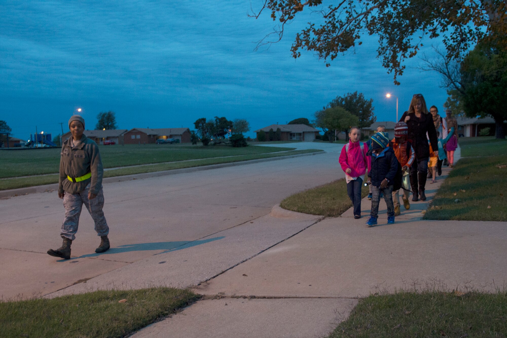 Students of L. Mendel Rivers Elementary School walk to school with teachers and Company Grade Officers, October 24, 2018, at Altus Air Force Base, Okla.