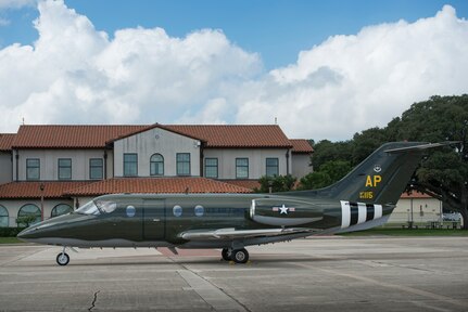 Assigned to the 45tst Flying Training Squadron in Pensacola, Florida is a T-1A Jayhawk with a paint scheme to resemble a WWII B-26 Marauder bomber, parked in front of Randolph Air Force Base Operations, Texas, October 5, 2018. The 451st FTS requested to have the original color, markings and insignia to match that which the 322nd Bomb Group applied to their 451st Bomb Squadron B-26 fleet for the D-Day bombings. (U.S. Air Force photo by Sean Worrell)