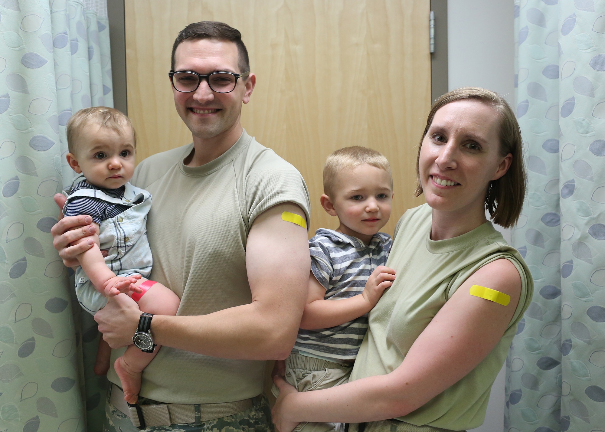 Doctors Anthony and Laura Sidari and sons Cameron and Tristan receive flu shots at the Wright-Patterson Medical Center’s immunization clinic. (Contributed photo)
