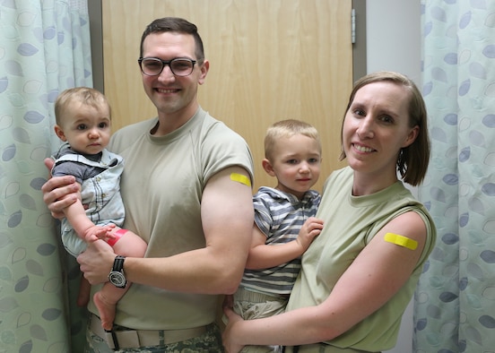 Doctors Anthony and Laura Sidari and sons Cameron and Tristan receive flu shots at the Wright-Patterson Medical Center’s immunization clinic. (Contributed photo)