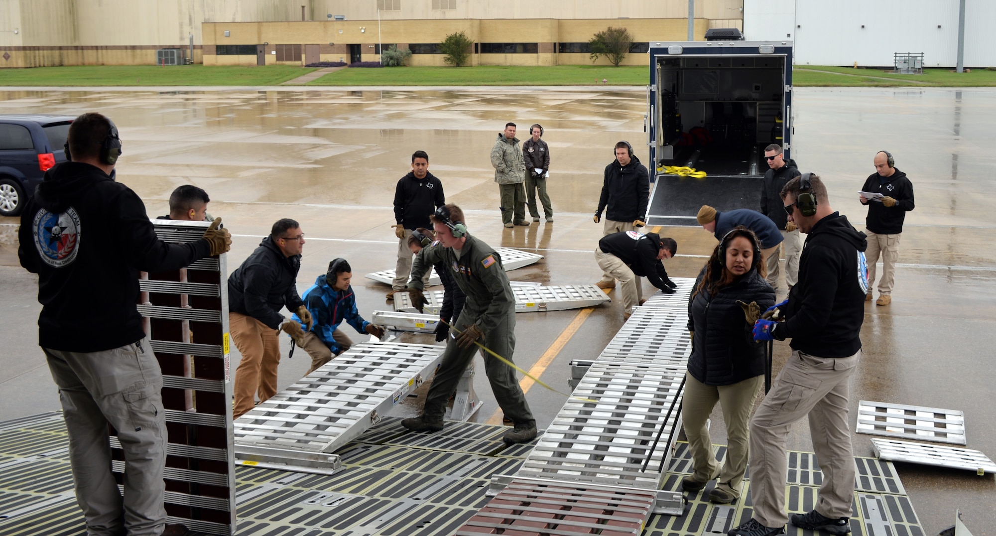 Members of the TX 6th WMD Civil Support Team and the 433rd Airlift Wing set up ramps in preparation to load a vehicle on a C-5M Super Galaxy Oct. 24, 2018 at Joint Base San Antonio-Lackland, Texas.