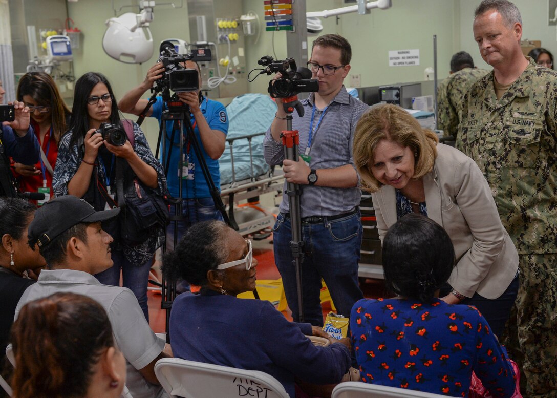 Ambassador Liliana Ayalde, civilian deputy to the commander, foreign policy advisor, U.S. Southern Command, meets with patients aboard the hospital ship USNS Comfort.