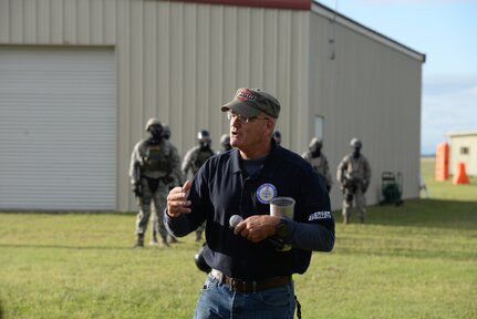 James Graham, 902nd Civil Engineer Squadron director, provides opening remarks prior to the start of the capture the flag challenge of the Battle of the Badges competition Oct. 20, 2018, at Joint Base San Antonio-Randolph’s Camp Talon. Firefighters and security forces members from Joint Base San Antonio locations have competed in Battle of the Badges for the past three years. The initiative was designed to build stronger bonds between the agencies and has become a tradition for the unit members, their families and friends.