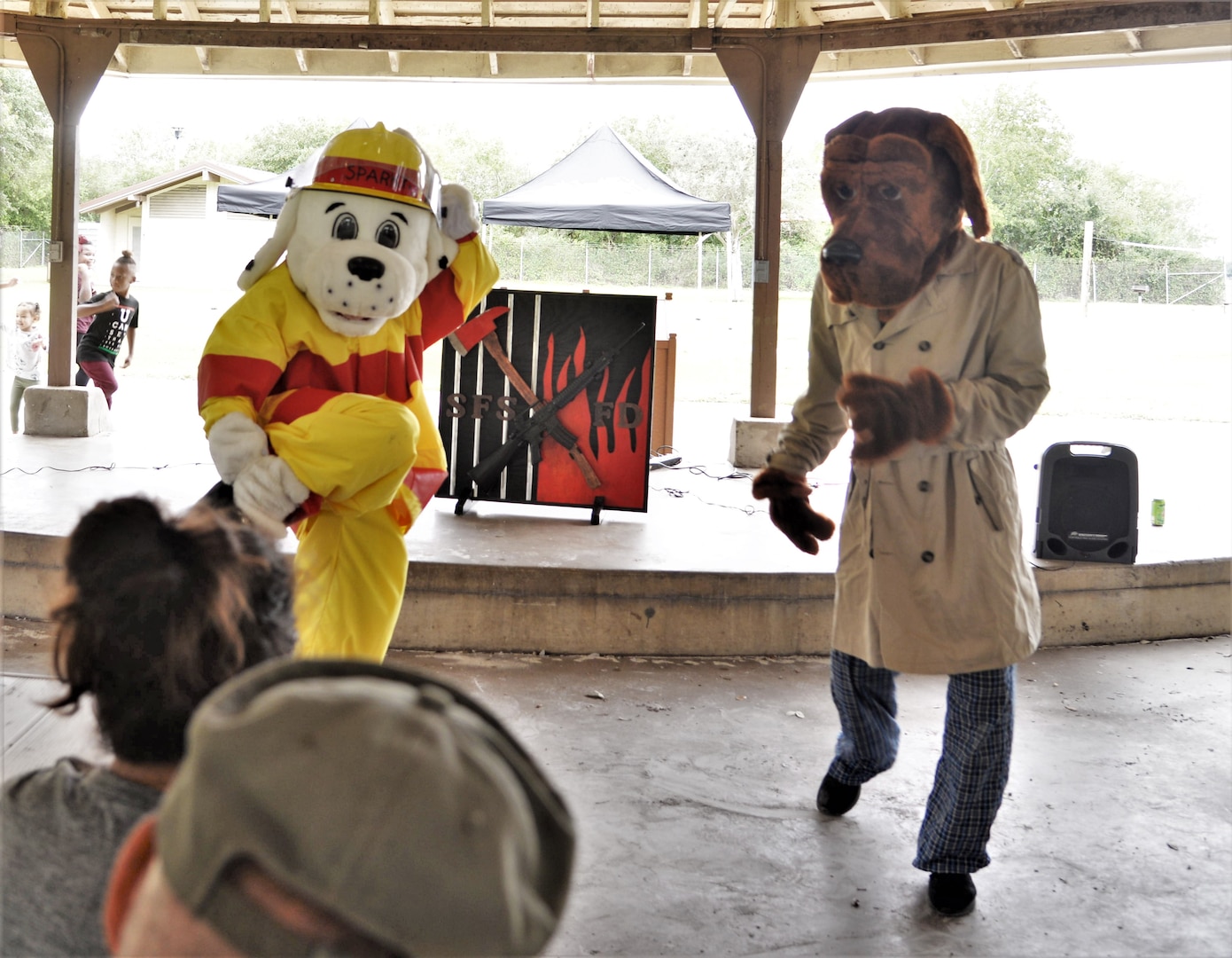 Sparky the Firedog and McGruff the Crime Dog compete in a dance-off as part of the Oct. 20, 2018, during the final challenge of the 2018 Battle of the Badges at Joint Base San Antonio-Randolph. Battle of the Badges takes place each year to build camaraderie, espirit de corps and cohesion among JBSA first responders through various competitive challenges taken from their daily missions.