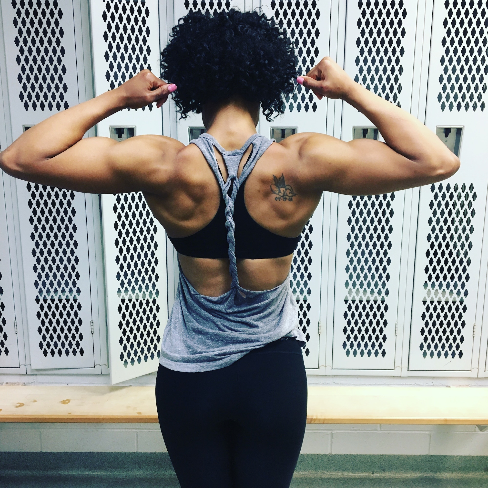 2nd Lt. Wendy Price, 88th Mission Support Group executive officer poses in the gym where she trains for bodybuilding competitions Oct. 17, 2018. Price began competing this year and has taken home four wins, ranging from first place to fifth place. (Courtesy photo)