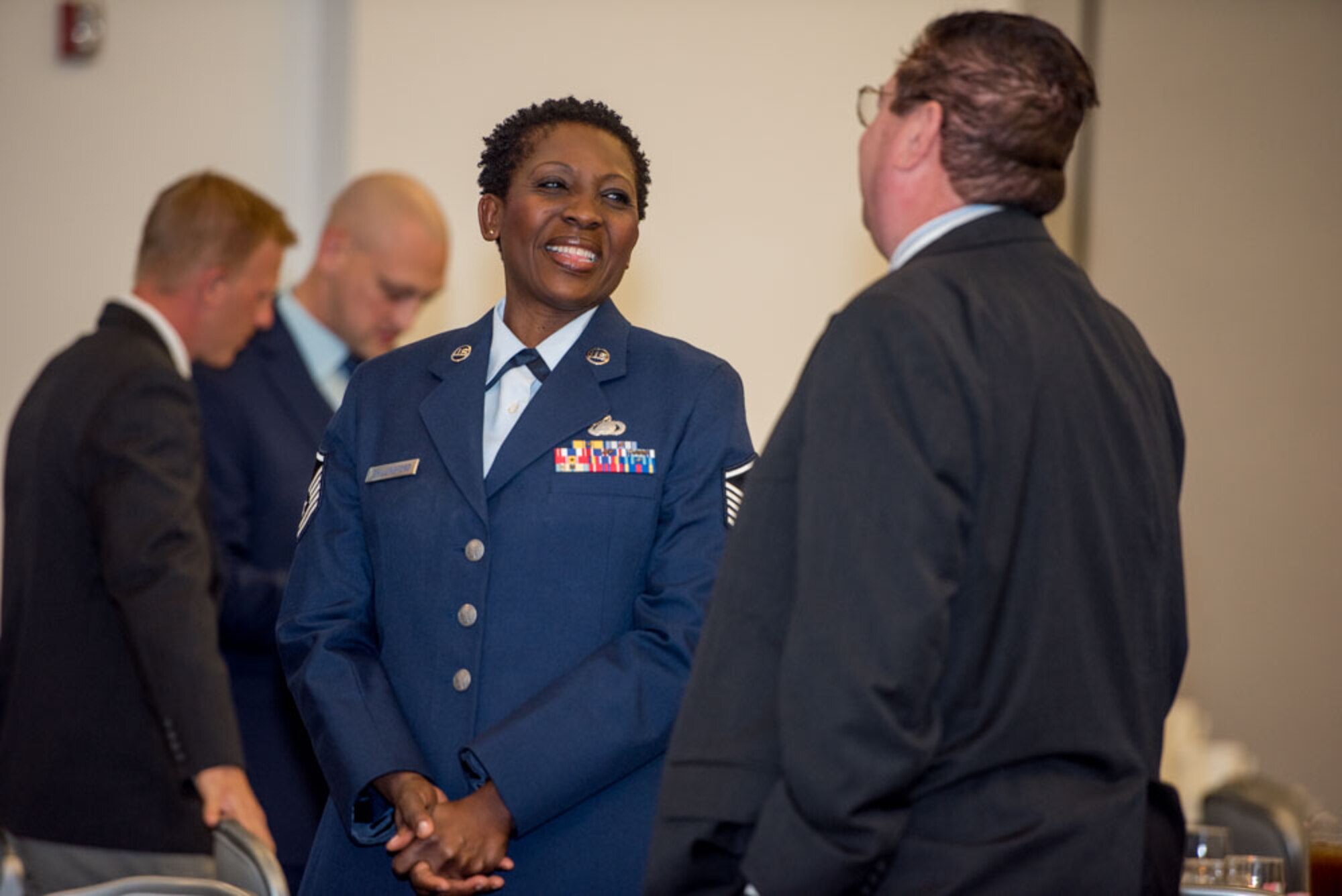 Master Sgt. Marina Shillingford, 512th Airlift Wing chief of career development, speaks with Ron Barisano, 512th Force Support Squadron honorary commander during the Honorary Commander Induction ceremony at Dover Air Force Base, Delaware, Oct. 20, 2018. Shillingford represented the 512th FSS commander during the event. (U.S. Air Force photo by Staff Sgt. Damien Taylor)