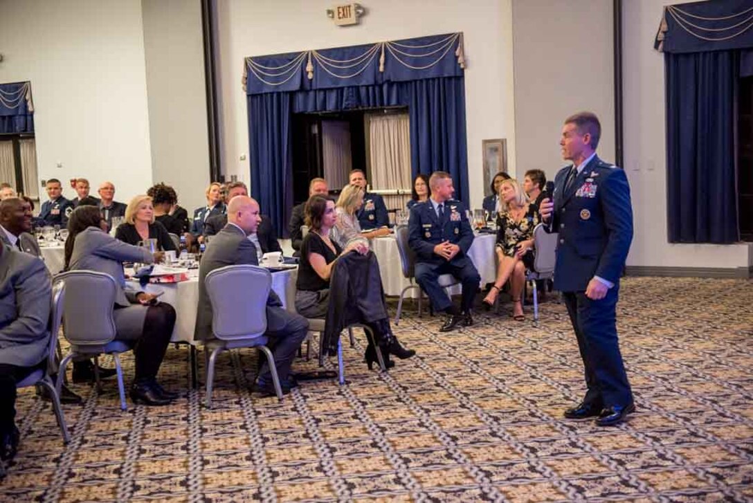 Col. Craig Peters, 512th Airlift Wing commander, delivers closing remarks during the Honorary Induction Ceremony at Dover Air Force Base, Delaware, Oct. 20, 2018. Nine new honorary commanders were inducted into the 512th AW for fiscal year 2019. (U.S. Air Force photo by Staff Sgt. Damien Taylor)