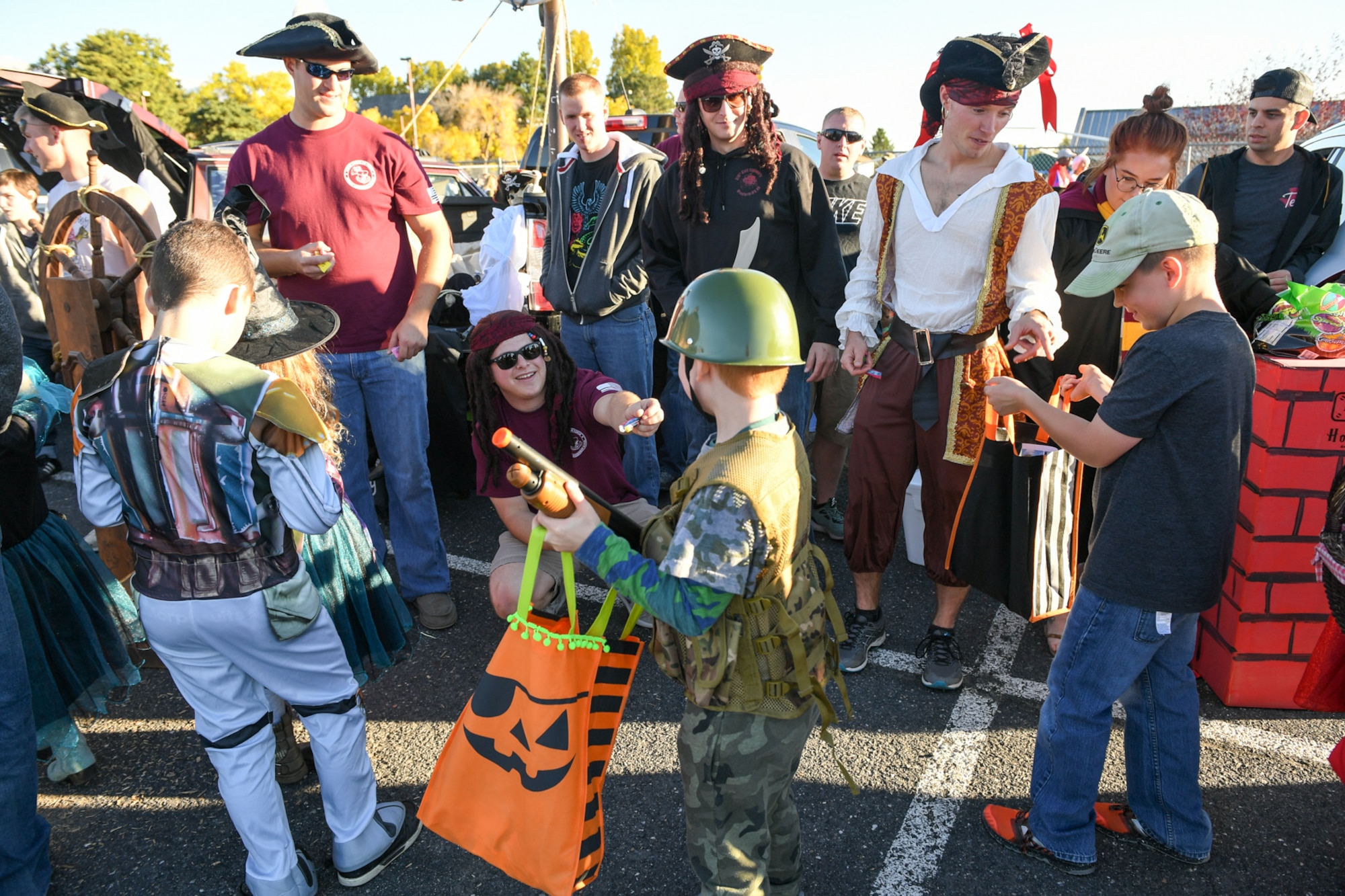 Airmen from the Airmen Leadership School hand Halloween treats to Trunk-or-Treaters during the Haunting on the Hill celebration Oct. 19, 2018 at Hill Air Force Base, Utah. (U.S. Air Force photo by Cynthia Griggs)