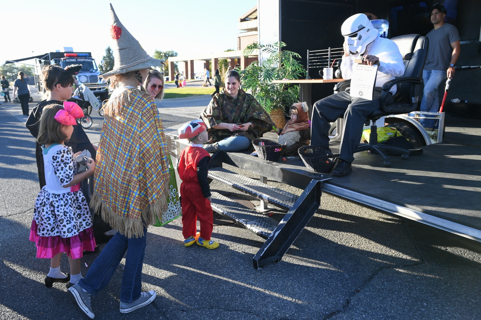 Capt. Rob Jensen, 368th Recruting Squadron, daughter Rachel, and wife, Capt. Madeleine Jensen, Hill Sexual Assault Prevention and Response, hand Halloween treats out to Trunk-or-Treaters during the Haunting on the Hill celebration Oct. 19, 2018 at Hill Air Force Base, Utah. (U.S. Air Force photo by Cynthia Griggs)