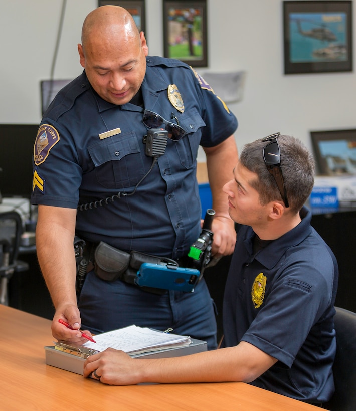 Mike Magana, Marine Corps Police Department, assisted in training new members of the police department on standard operating procedures of how to conduct interviews, aboard Marine Corps Logistics Base Barstow, California, Oct. 16.
(U.S. Marine Corps Photo by Jack J. Adamyk)