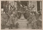 Soldiers of the New York National Guard's 27th Division celebrating the end of World War I following the Armistice on Nov. 11, 1918. According to Maj. Gen. John O'Ryan, the commander of the division, this photo and others like it were staged in the days following the signing of the document that ended combat in the World War by U.S. Army Signal Corps photographers.