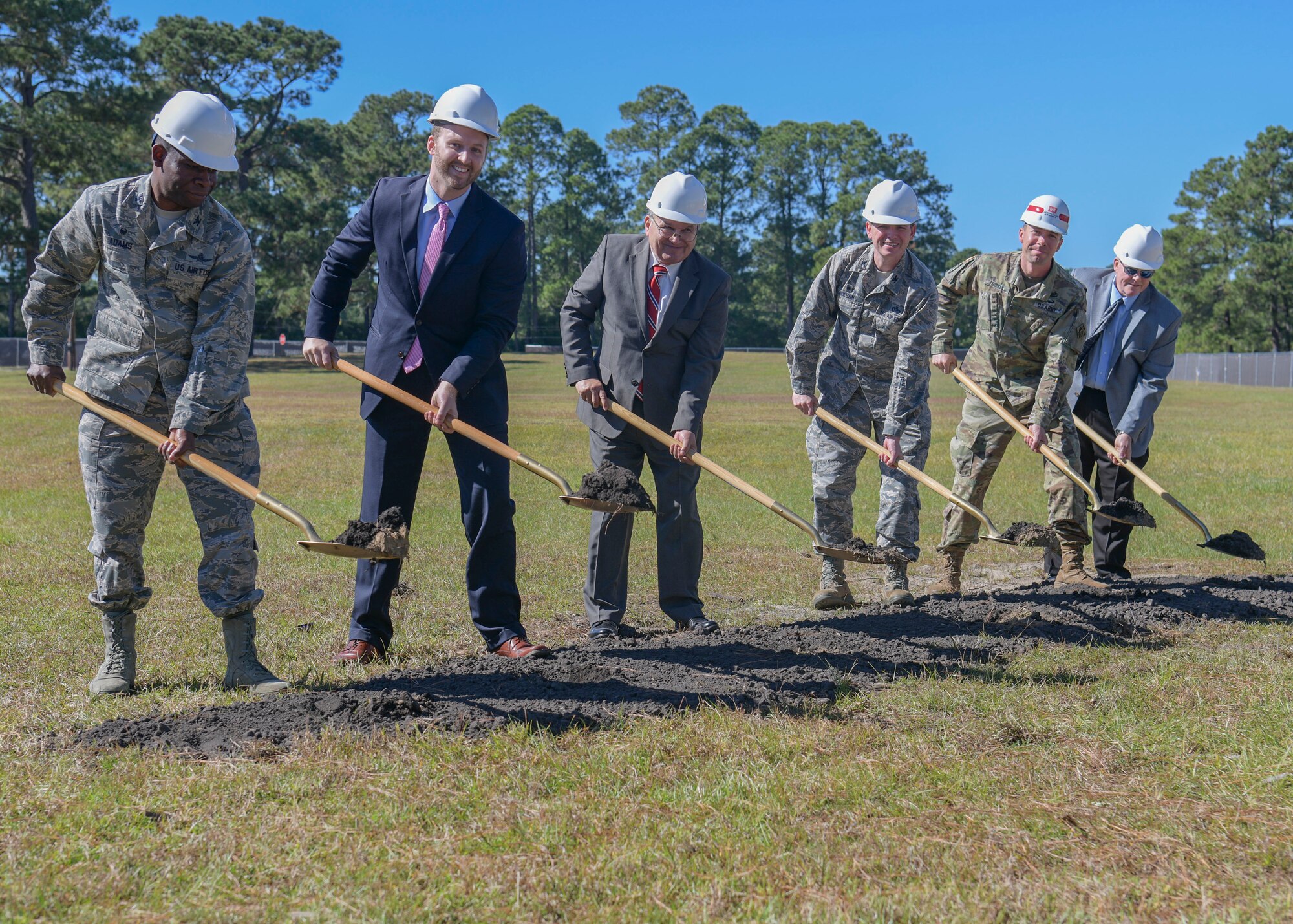 Col. Terrence Adams (left), Joint Base Charleston commander, breaks ground alongside project coordinators for the new Visitor’s Quarters Oct. 24, 2018, on Joint Base Charleston S.C. The project is a result of low vacancy at the current Visitor’s Quarters. The modernized four-story structure will have 266 guest rooms, conference rooms, an exercise room, guest laundry and other amenities covering 150,000 square-feet. The Visitor’s Quarters project is slated for completion in fall 2020.