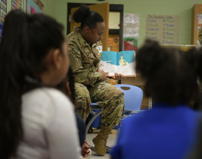 Airman 1st Class Demani Scott, 628th Comptroller Squadron comptroller, reads to students at Pepperhill Elementary School Oct. 24, 2018, in North Charleston, S.C. Airmen from the 628th CPTS went to the school to read to children and answer any questions the children had about being an Airmen.