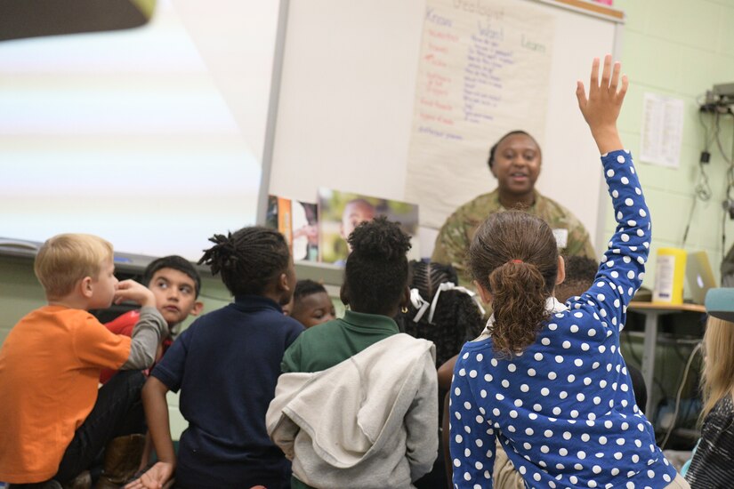 Airman 1st Class Demani Scott, 628th Comptroller Squadron comptroller, answers a student’s question at Pepperhill Elementary School Oct. 24, 2018, in North Charleston, S.C. Airmen from the 628th CPTS went to the school to read to children and answer any questions the children had about being an Airmen.