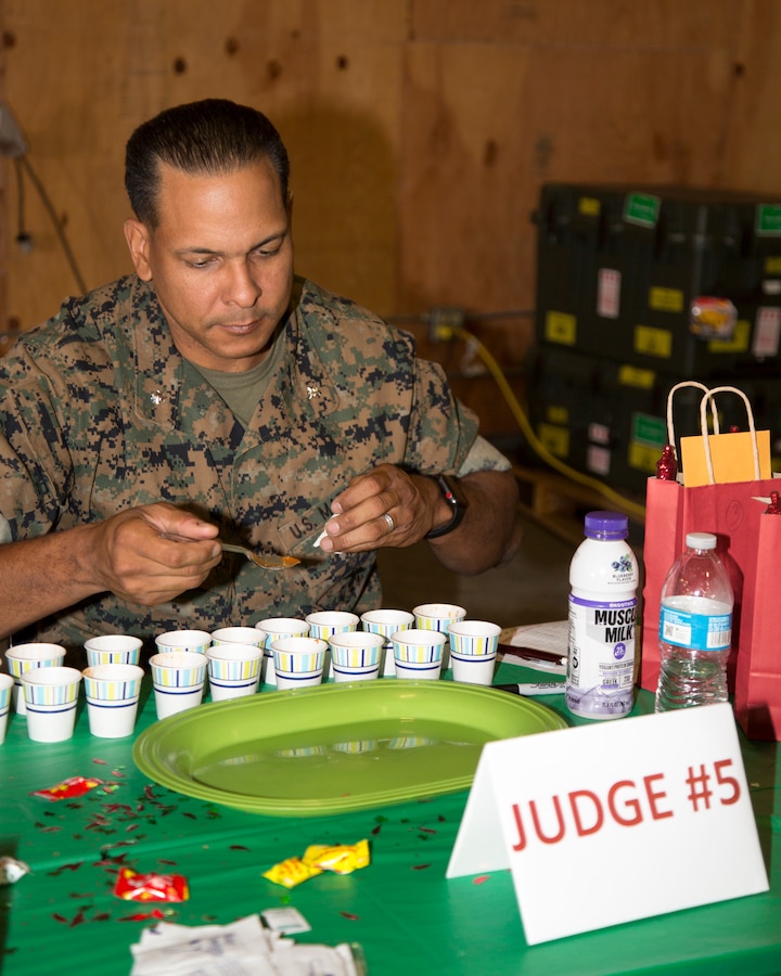 Lieutenant Colonel Tarrell Giersch, director of Fleet Support Division, tastes a variety of chilis, carefully judging for taste, texture and spice or sweetness during the FSD Annual Chili Cookoff Event held on the Yermo Annex aboard Marine Corps Logistics Base Barstow, Calif., Oct. 24. Of the 19 chili submissions, the four judge panel selected their top three and awarded prizes to those participants.