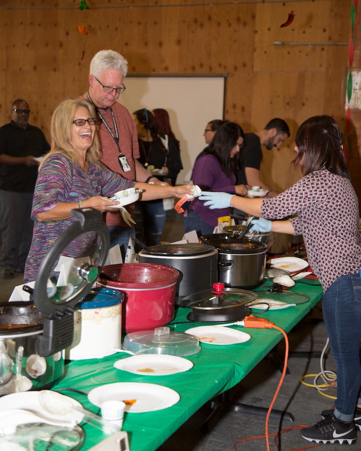 Employees from Fleet Support Division enjoy trying various chilis during their annual Chili Cookoff event held on the Yermo Annex aboard Marine Corps Logistics Base Barstow, Calif., Oct. 24. Four judges tasted 19 chili varations and selected their top three favorites, awarding prizes to the winners. By all accounts, it was a close call!