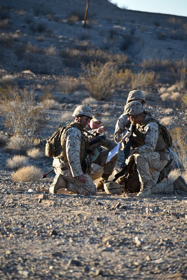 Sgt. Benjamin Crouch, Supply Administrator, delivers patrol instructions to his team during the HQCO field training exercise aboard Marine Corps Logistics Base Barstow, California, Oct. 18. This field exercise was to provide proof of concept, capability and refresh basic troop skills.
(U.S. Marine Corps Photo by Gunnery Sgt. James Hainer)