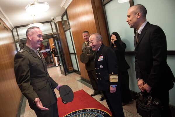 U.S. Chairman of the Joint Chiefs of Staff Gen. Joe Dunford speaks with his counterpart Japanese Chief of Staff Adm. Katsutoshi Kawano before multilateral meetings between U.S., Japanese, and Republic of Korean military officials at the Pentagon, Oct. 26, 2018.