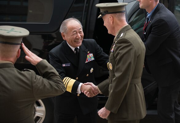 U.S. Chairman of the Joint Chiefs of Staff Gen. Joe Dunford greets his counterpart Japanese Chief of Staff Adm. Katsutoshi Kawano before multilateral meetings between U.S., Japanese, and Republic of Korean military officials at the Pentagon, Oct. 26, 2018.