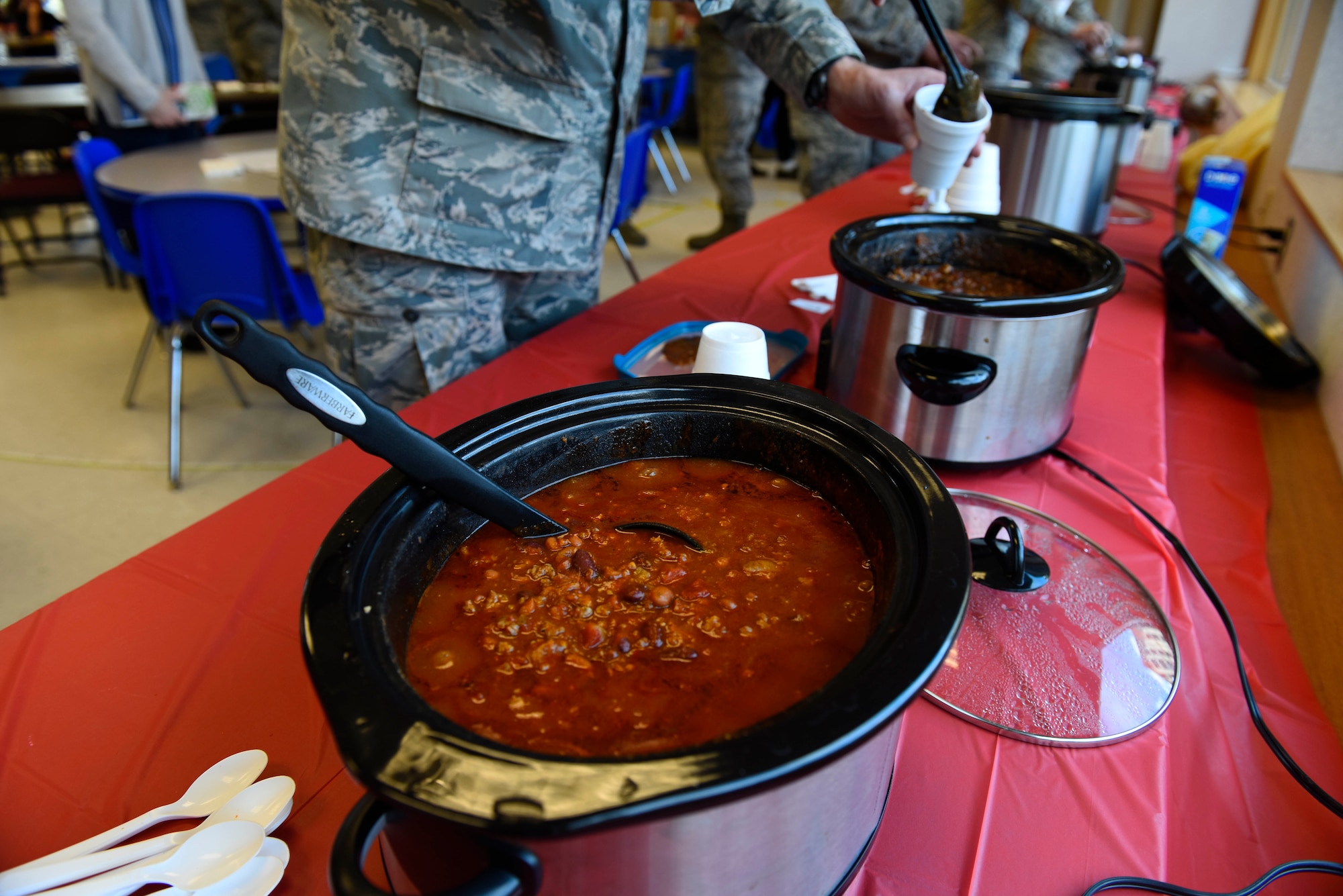 Slow cookers filled with chili simmer while Airmen prepare to taste and judge their favorite as part of a "Chili Cook-Off" promoting the 2018 Combined Federal Campaign Kick-Off at Fairchild Air Force Base, Washington, Oct. 24, 2018. The 92nd Air Refueling Wing CFC representatives host the campaign annually for a six-week period, ecouraging Airmen and their families to donate money or time to a charity or nonprofit organization of their choice. (U.S. Air Force photo/Airman 1st Class Lawrence Sena)