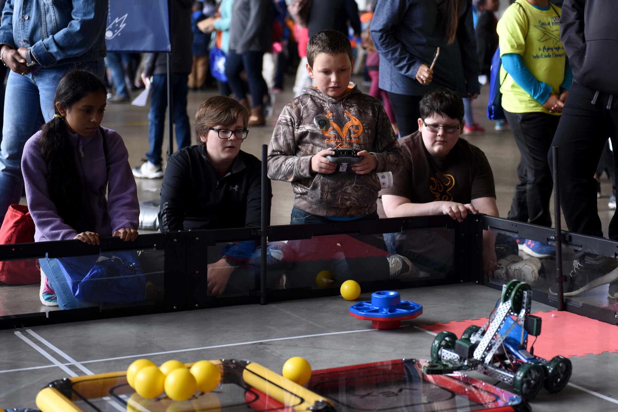 Boys play with robots.