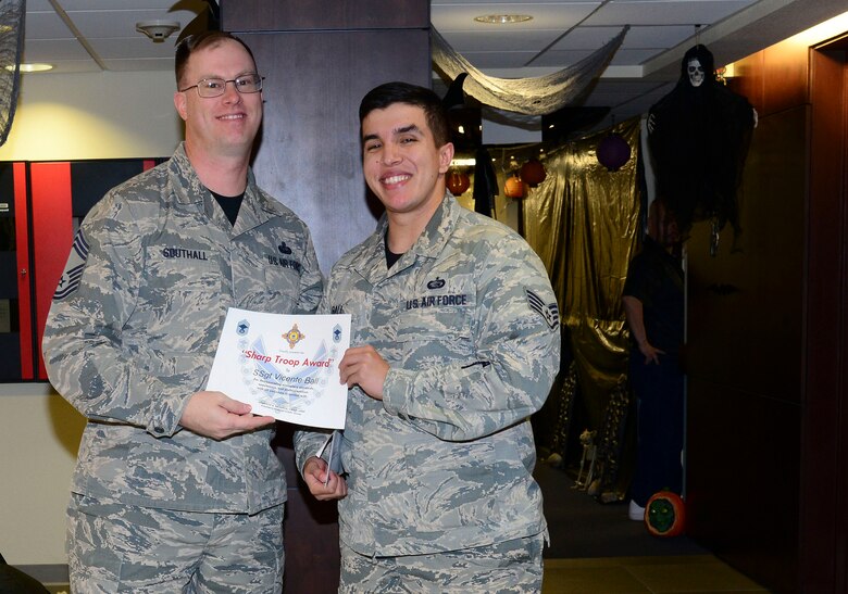 Chief Master Sgt. David Southall II, Chief Enlisted Manager of the Air Force Operational Test and Evaluation Center, awards Staff Sgt. Vicente Ball the Sharp Troop Award here Oct 26. Ball was given the award to formally recognize his efforts in the planning and coordination of the POW-MIA ceremony at the veteran’s memorial in September. The award is given for exceptional professionalism and contribution to the mission. (U.S. Air Force photo by Jessie Perkins)