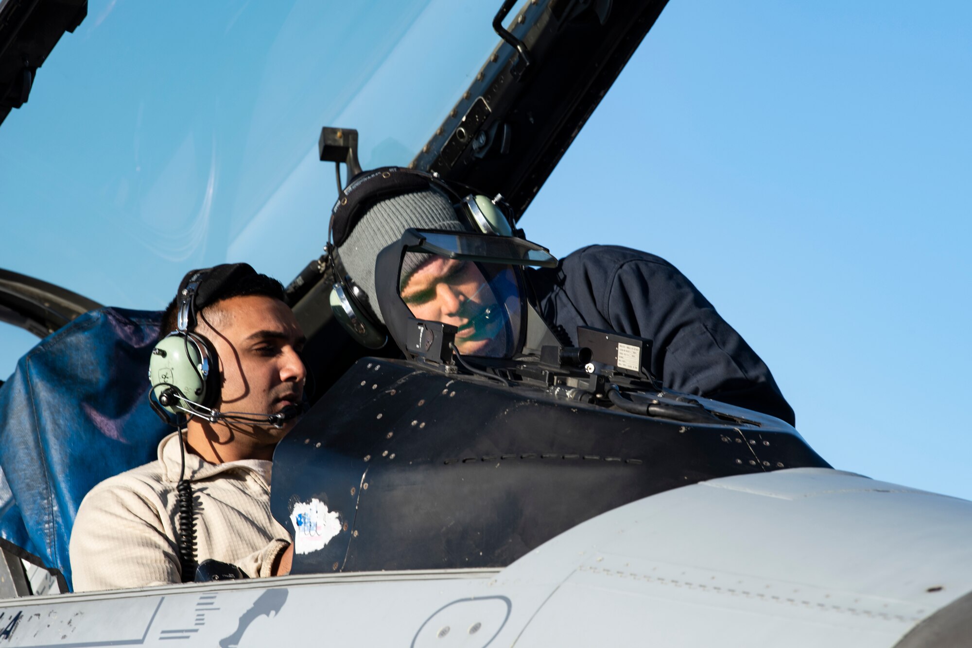 Staff Sgt. Mark Ward mentors Senior Airman Bheem Zohar as they conduct a flight control built in test for an F-16 Fighting Falcon October 25, 2018. Ward and Bheem are both crew chiefs assigned to the 80th Aircraft Maintenance Unit, which is at Eielson Air Force Base, Alaska participating in exercise Distant Frontier. Distant Frontier is a continuation of the training provided during RED FLAG-Alaska, but allows for a more tailored mission scenarios that can better meet participating unit's training objectives. (U.S. Air Force photo by Staff Sgt. Levi Rowse)