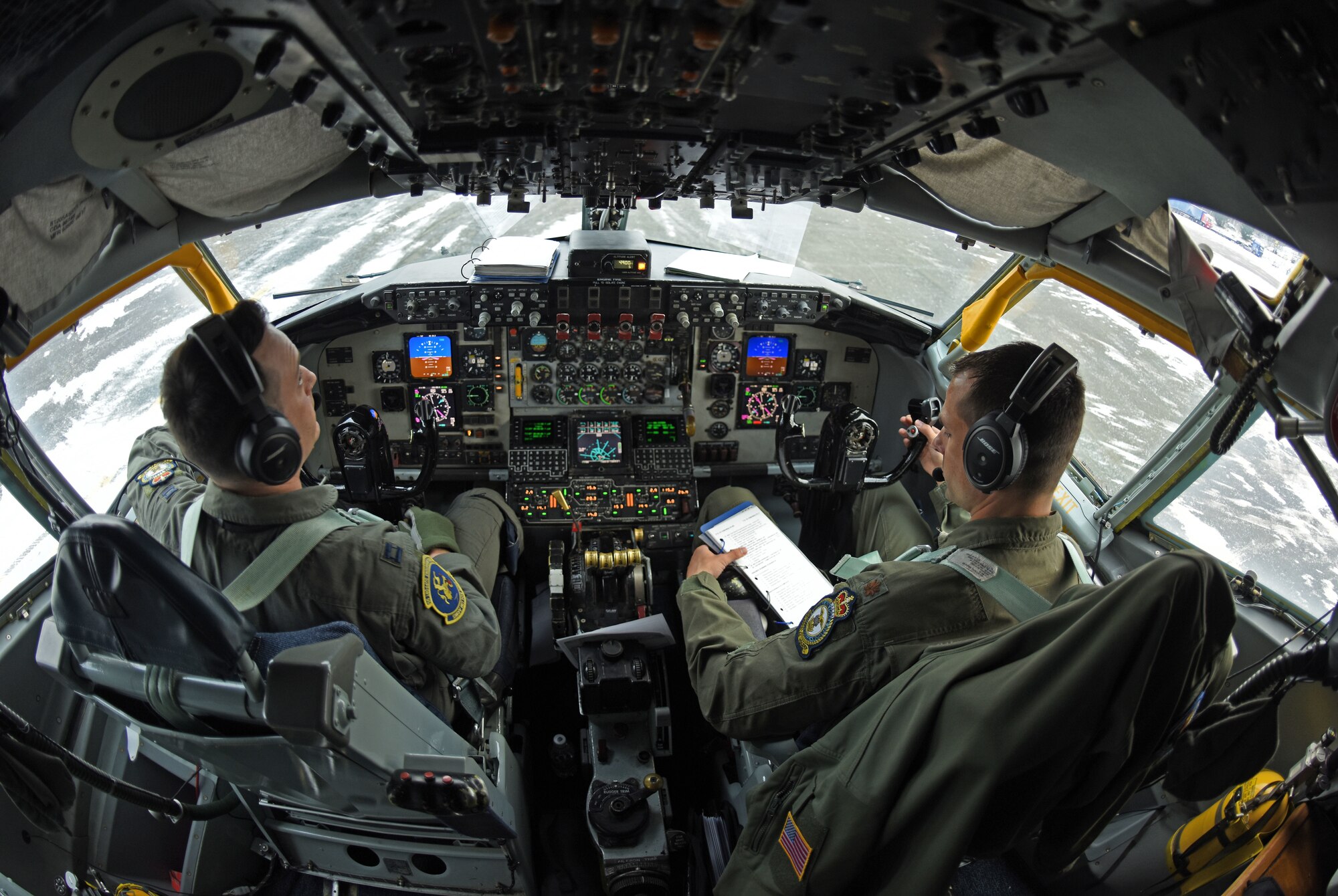 U.S. Air Force Capt. Frank Simon and U.S. Air Force Maj. Micah Yost, 351st Air Refueling Squadron pilots, perform preflight checks before conducting aerial refueling training during Exercise Trident Juncture 18, at Rovaniemi, Finland, Oct. 27, 2018. Trident Juncture is the largest NATO exercise since 2015, with participation of more than 50,000 military members from 31 nations. The 100th Air Refueling Wing supported the exercise with two KC-135s and crew. (U.S. Air Force photo by Senior Airman Luke Milano)