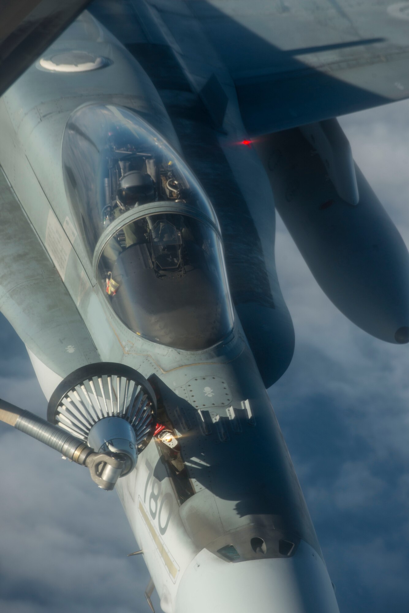 A Royal Canadian Air Force CF-188 Hornet receives fuel from a U.S. Air Force KC-135 Stratotanker during Exercise Trident Juncture 18, off the coast of Norway, Oct. 27, 2018. Trident Juncture is the largest NATO exercise since 2015, with participation of more than 50,000 military members from 31 nations. The exercise helps ensure NATO’s capability to deter and defend against any adversary. (U.S. Air Force photo by Senior Airman Luke Milano)