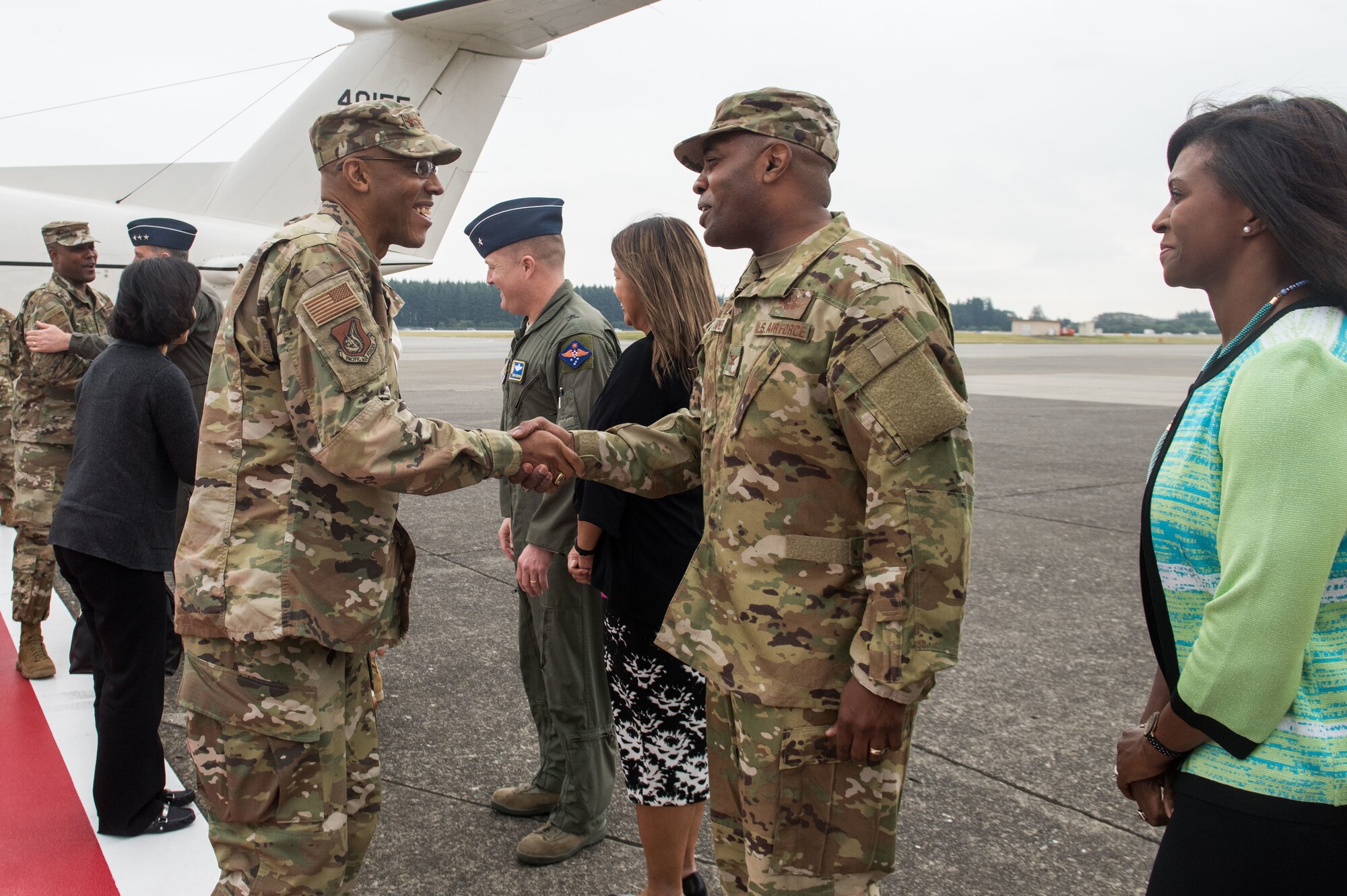 U.S. Air Force Gen. CQ Brown, Jr., Pacific Air Forces commander, shakes hands with Col. Otis C. Jones