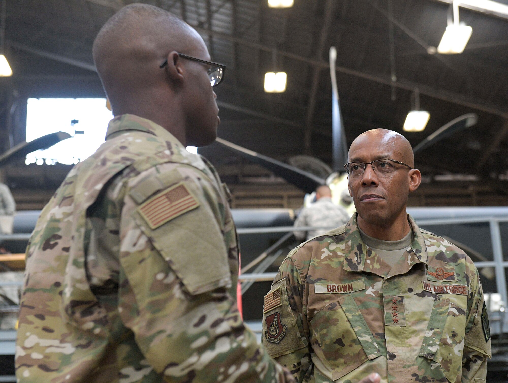 U.S. Air Force Gen. CQ Brown, Jr., Pacific Air Forces commander, speaks with Staff Sgt. Collin Eddington,