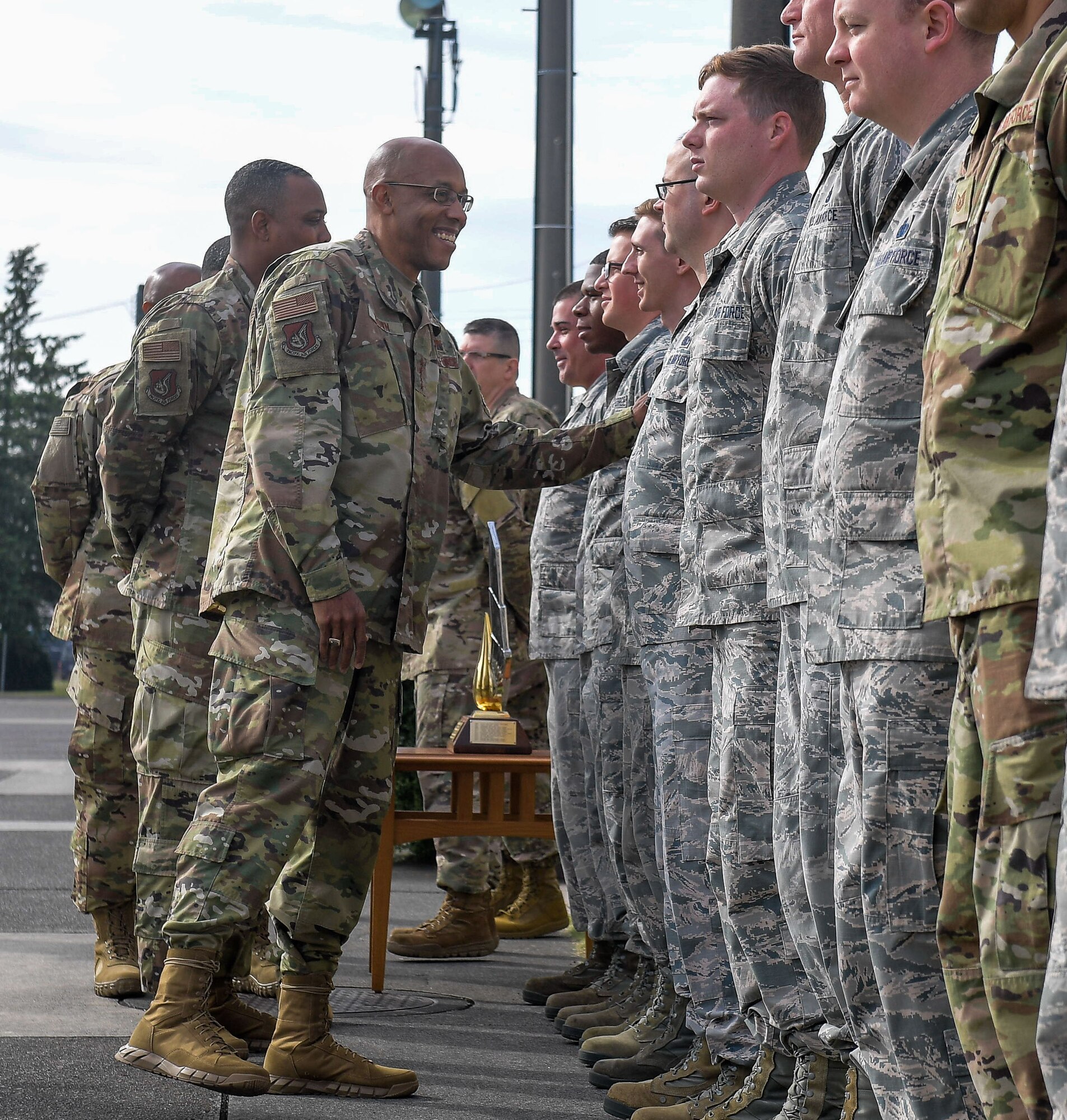 U.S. Air Force Gen. CQ Brown, Jr., Pacific Air Forces (PACAF) commander, talks with 374th Logistics Readiness Squadron Airmen, during a visit to the Petroleum, Oils and Lubricants (POL) shop