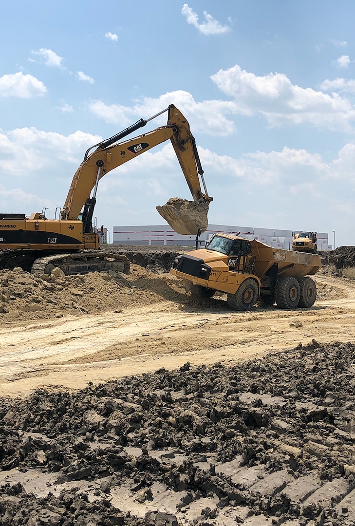 Workers excavate a site at Urban Mining Company’s facility for manufacturing neodymium/iron/boron magnets in San Marcos, Texas.