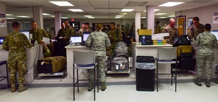 As deplorers pack into the Joint Base Charleston Temporary Passenger Terminal, the passenger operations flight works to get them checked in, process their bags and get them through security checkpoints Oct. 15, 2018.